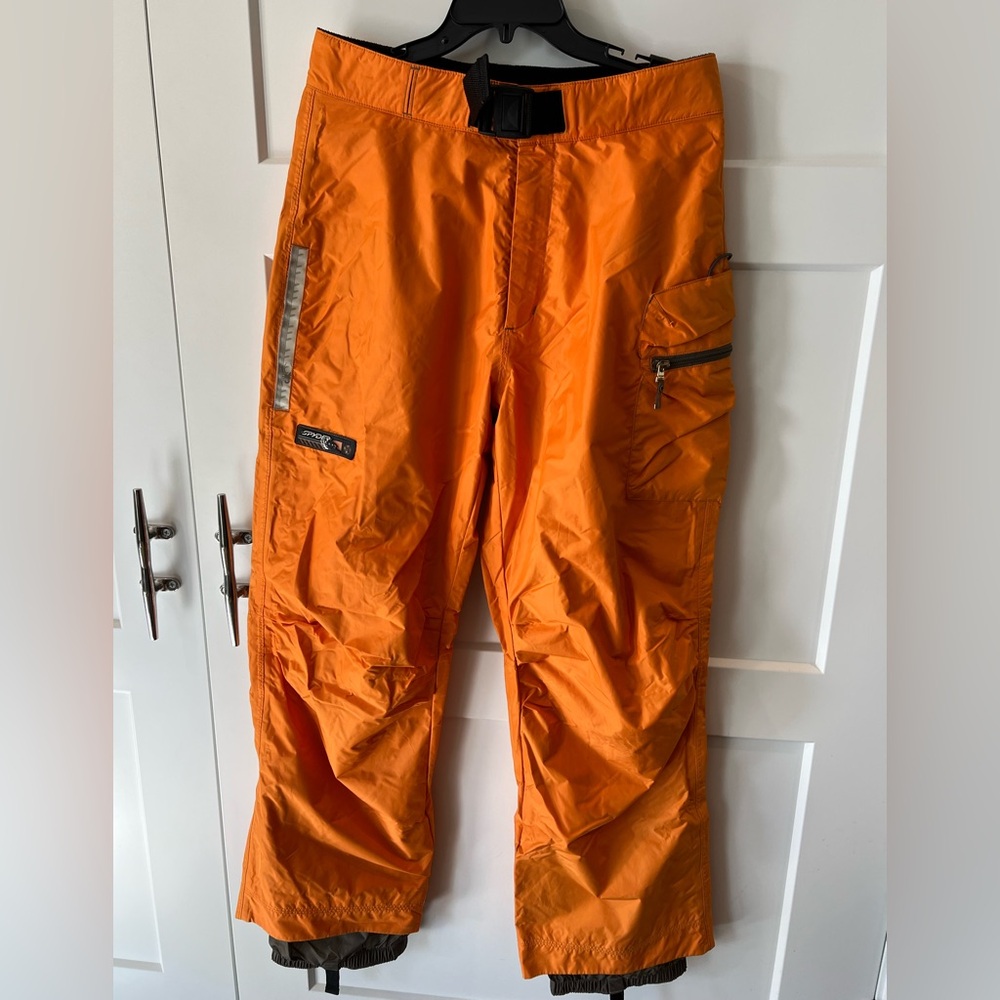 Spyder orange outershell waterproof and wind proof ski pants in used condition.